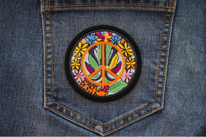 Daisies Peace Patch shown on jeans