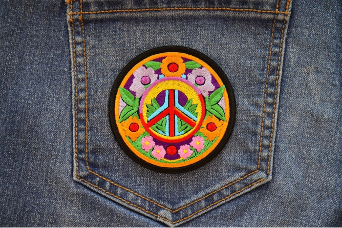 Flowers and Peace Patch shown on jeans