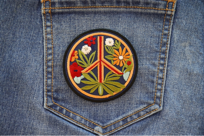 Hippie Flower Peace Patch shown on jeans