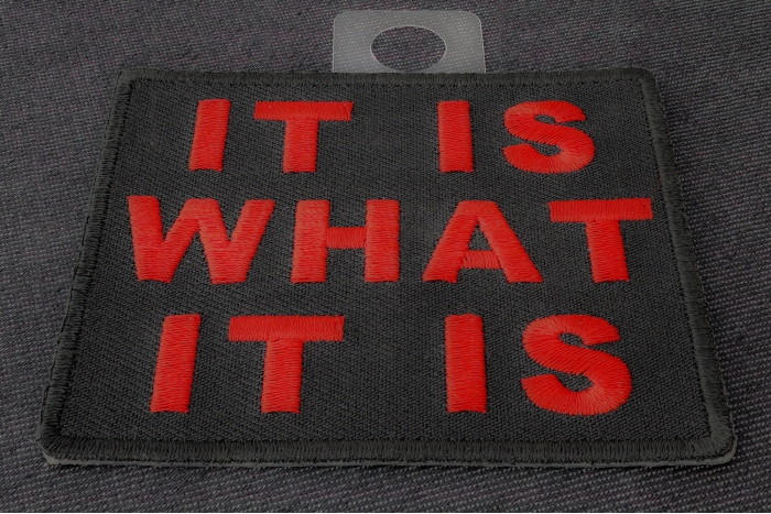 It Is What It Is Iron on Morale Patch In Red diagonal view