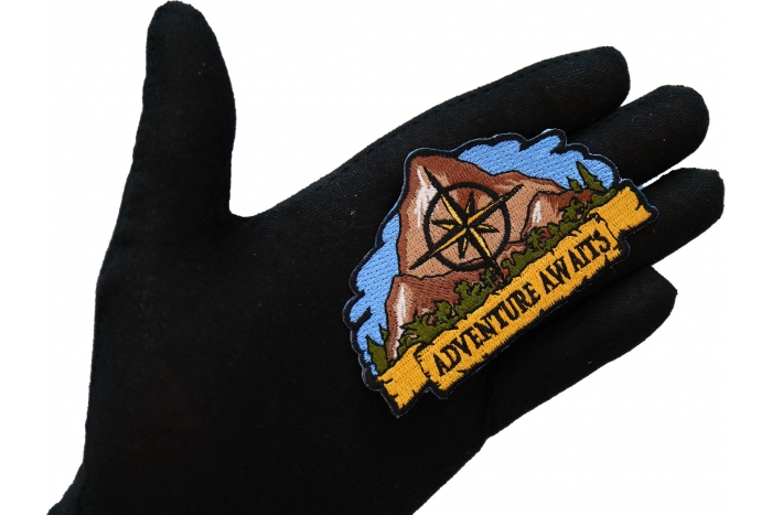 Adventure Awaits Hiker Patch shown on hand for size comparison