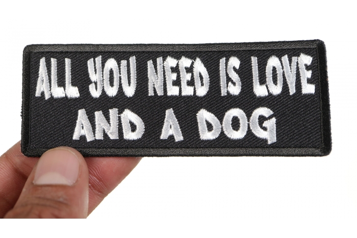 All You Need is Love And a Dog Morale Patch shown on hand for size comparison