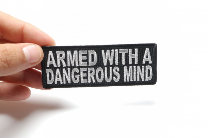 Armed With A Dangerous Mind Iron on Morale Patch shown on hand for size comparison