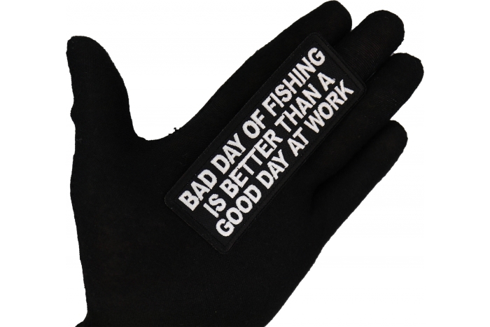 Bad Day of Fishing is Better than a Good Day at Work Patch shown on hand for size comparison