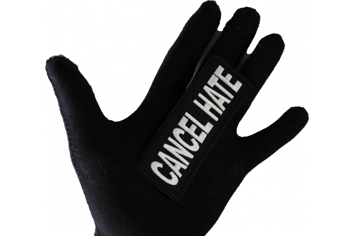 Cancel Hate Patch shown on hand for size comparison