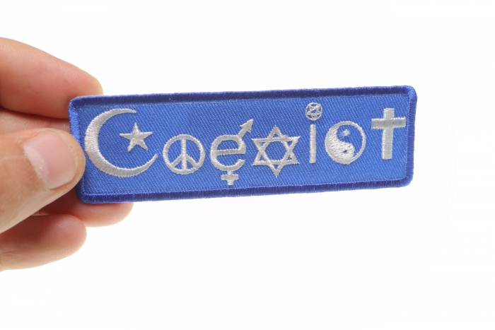 Coexist Iron on Morale Patch shown on hand for size comparison