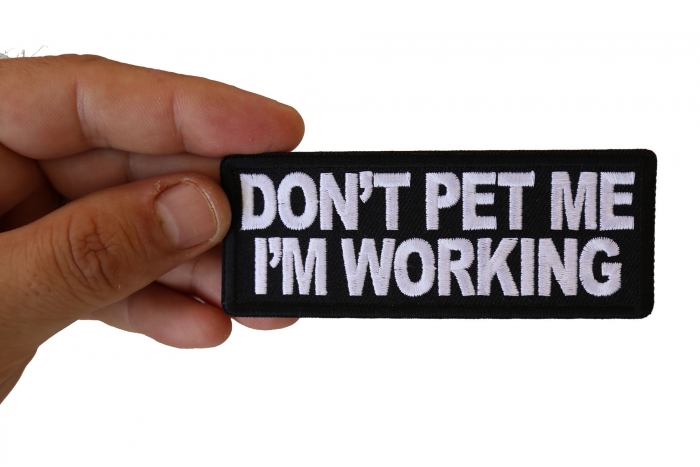 Don't Pet Me I'm Working Patch shown on hand for size comparison