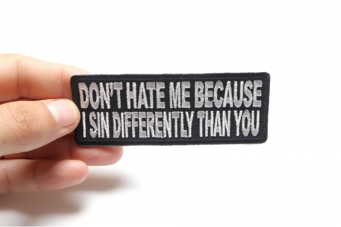 Don't Hate Me Because I Sin Differently Than You Iron on Morale Patch shown on hand for size comparison