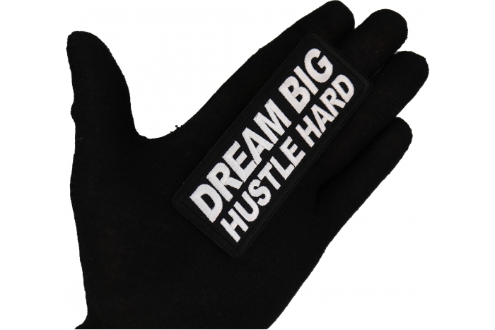 Dream Big Hustle Hard Patch shown on hand for size comparison