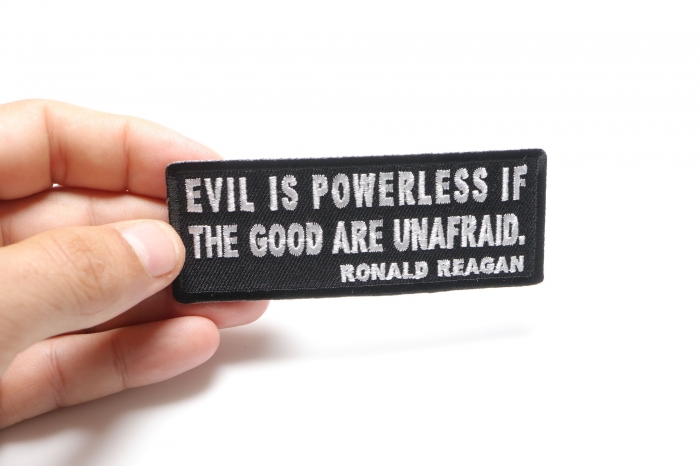 Evil is Powerless if the Good are Unafraid Iron on Morale Patch shown on hand for size comparison
