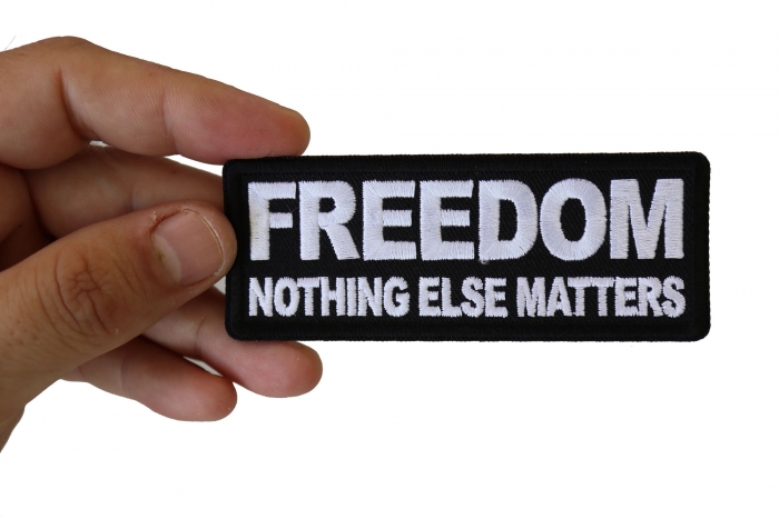 Freedom Nothing Else Matters Iron on Morale Patch shown on hand for size comparison