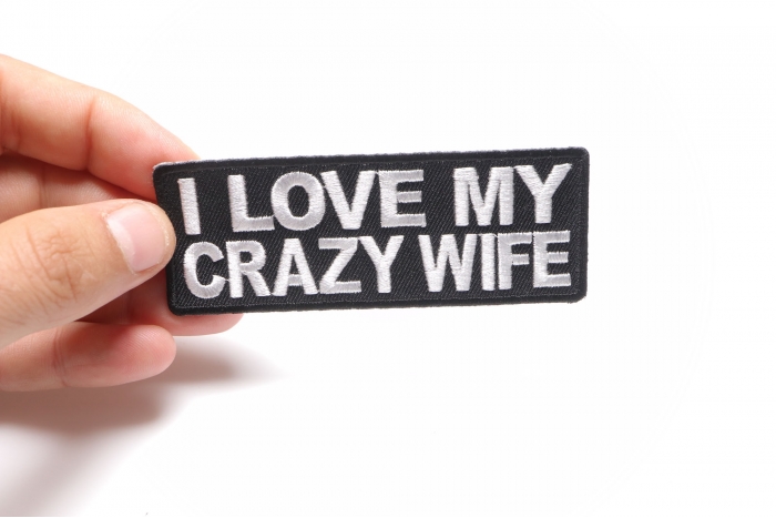 I Love My Crazy Wife Iron on Morale Patch shown on hand for size comparison