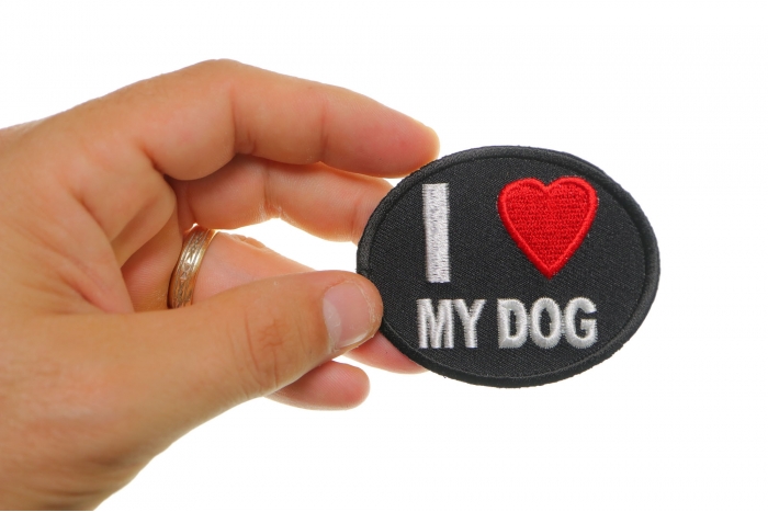 I Love My Dog Iron on Morale Patch shown on hand for size comparison