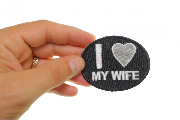 I Love My Wife Iron on Morale Patch shown on hand for size comparison