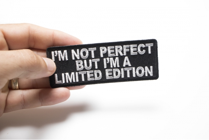 I'm Not Perfect But I'm A Limited Edition Iron on Morale Patch shown on hand for size comparison