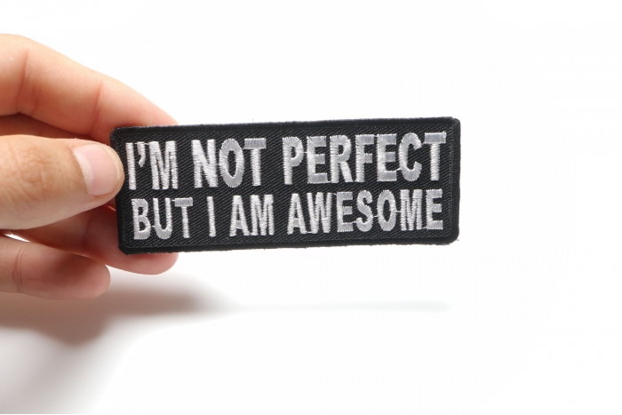 I'm Not Perfect But I'm Awesome Iron on Morale Patch shown on hand for size comparison
