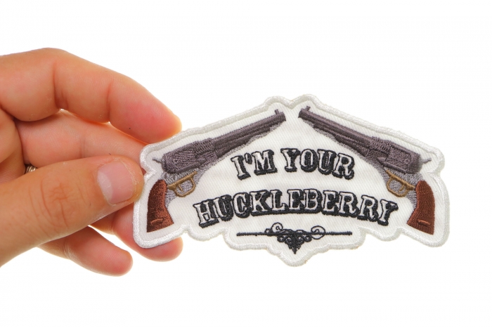 I'm Your Huckleberry Iron on Morale Patch shown on hand for size comparison