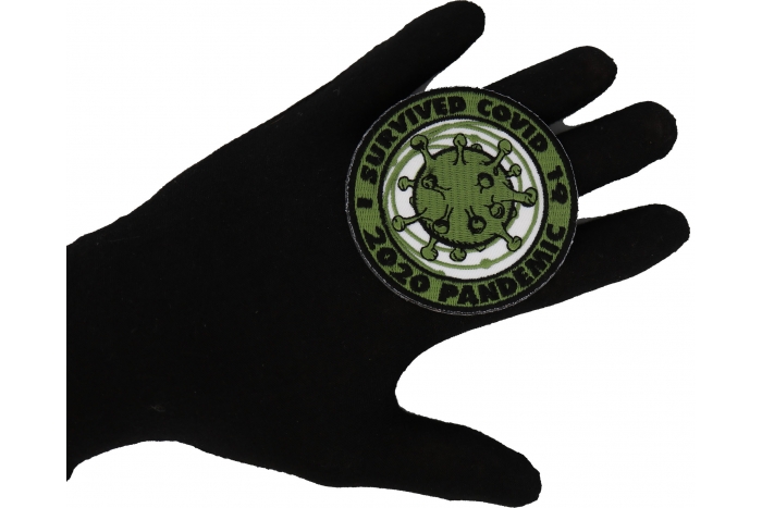 I survived covid 19 Iron on Corona Virus Patch shown on hand for size comparison