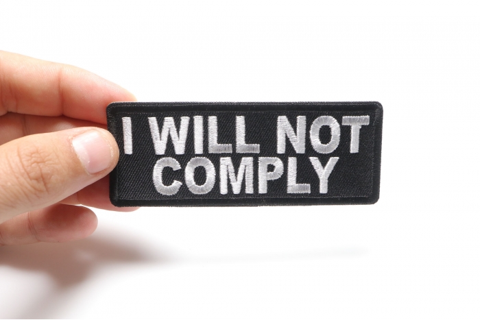 I will not comply Iron on Morale Patch shown on hand for size comparison