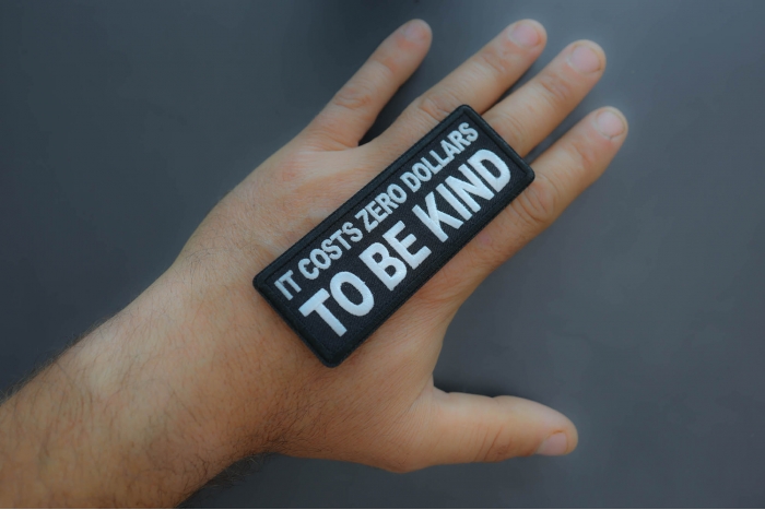 It costs zero dollars to be kind patch shown on hand for size comparison