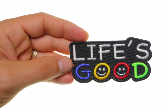 Life's Good Iron on Morale Patch shown on hand for size comparison