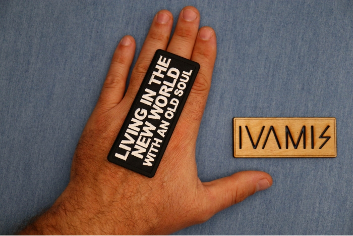 Living in the New World with an Old Soul Patch shown on hand for size comparison