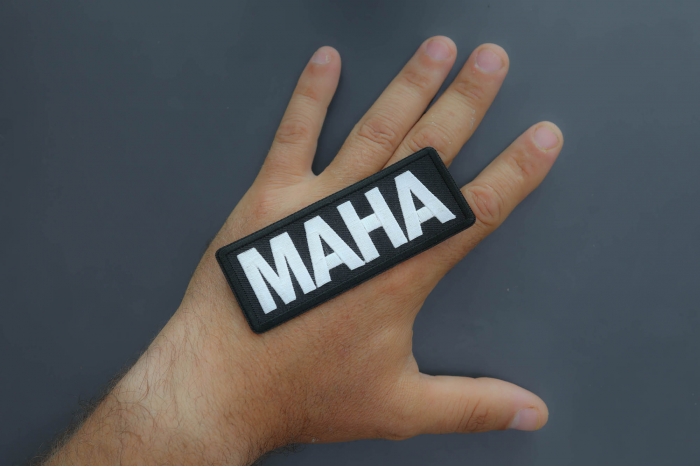 MAHA Patch shown on hand for size comparison