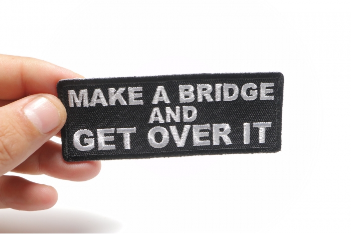 Make a Bridge and Get Over It Iron on Morale Patch shown on hand for size comparison