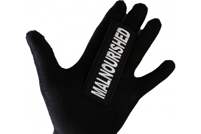 Malnourished Patch shown on hand for size comparison