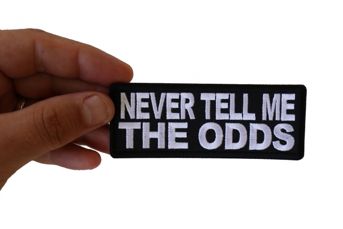 Never Tell me the Odds Patch, Biker Sayings shown on hand for size comparison