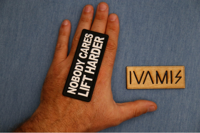 Nobody Cares Lift Harder Patch shown on hand for size comparison