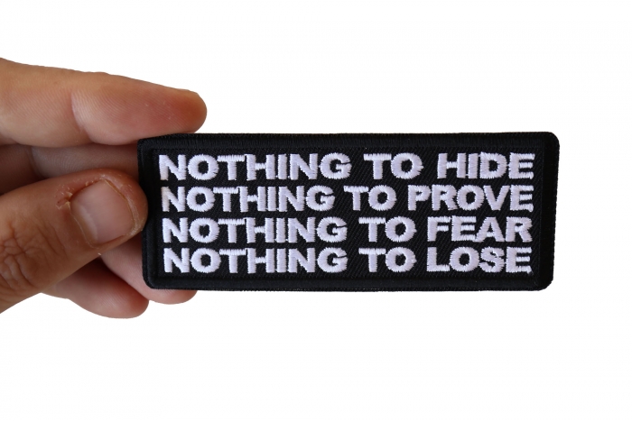 Nothing to Hide Prove Fear Lose Iron on Morale Patch shown on hand for size comparison