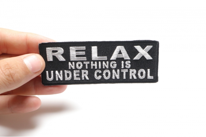 Relax Nothing Is Under Control Iron on Morale Patch shown on hand for size comparison