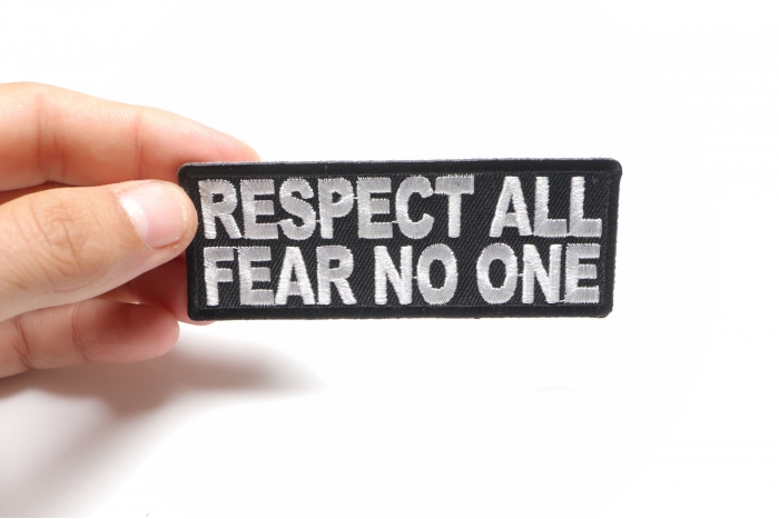 Respect All Fear No One Iron on Morale Patch shown on hand for size comparison