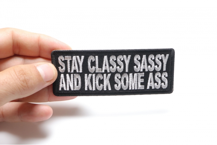 Stay Classy Sassy and Kick Some Ass Iron on Morale Patch shown on hand for size comparison