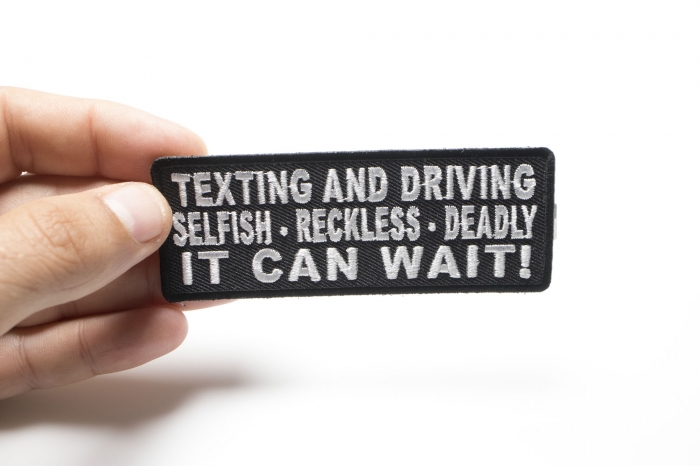 Texting and Driving Selfish Reckless Deadly It Can Wait Iron on Patch shown on hand for size comparison