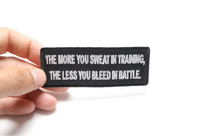 The More You Sweat In Training, The Less You Bleed in  Battle Patch, Military Saying Patches shown on hand for size comparison