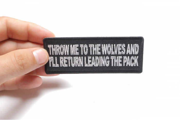 Throw Me to the Wolves and I'll Return Leading the Pack Iron on Morale Patch shown on hand for size comparison