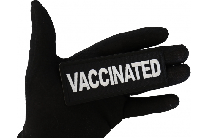 Vaccinated Patch shown on hand for size comparison