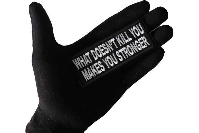 What Doesn't Kill You Makes You Stronger Patch shown on hand for size comparison