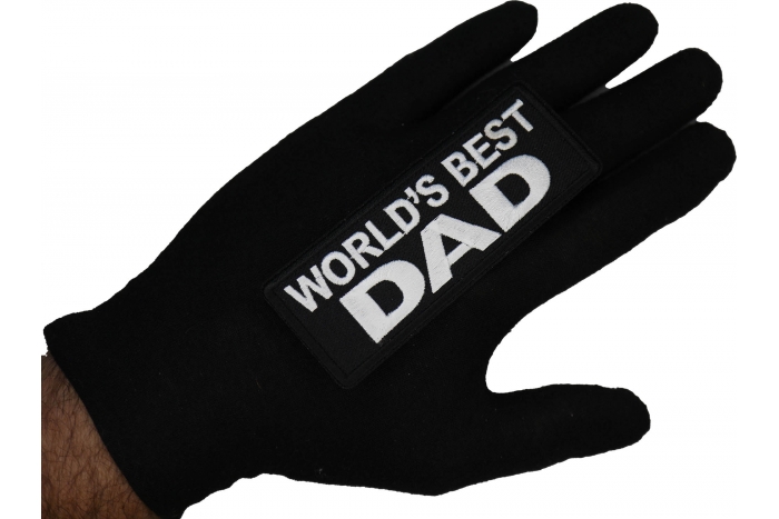World's Best Dad Patch shown on hand for size comparison