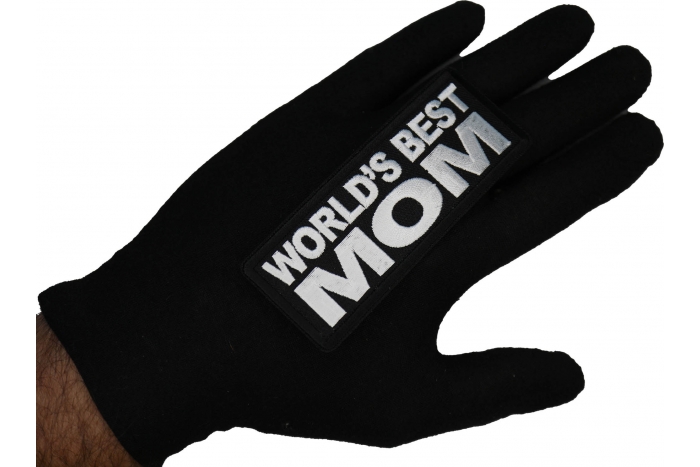 World's Best Mom Patch shown on hand for size comparison