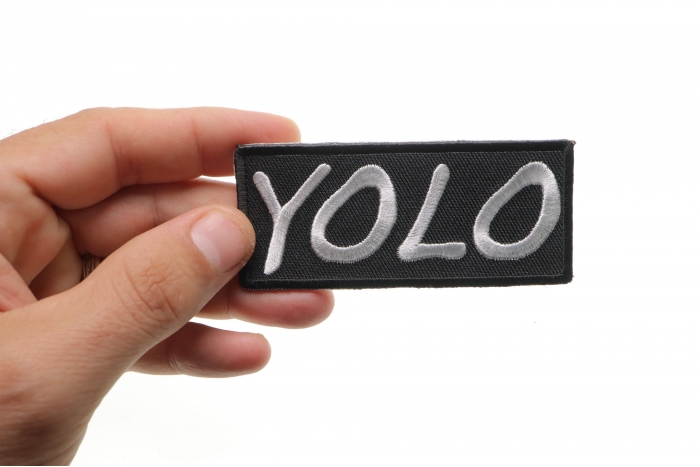 Yolo Iron on Morale Patch shown on hand for size comparison