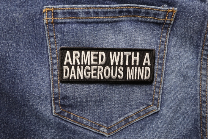 Armed With A Dangerous Mind Iron on Morale Patch shown on jeans