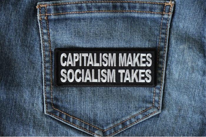 Capitalism Makes Socialism Takes Patch shown on jeans