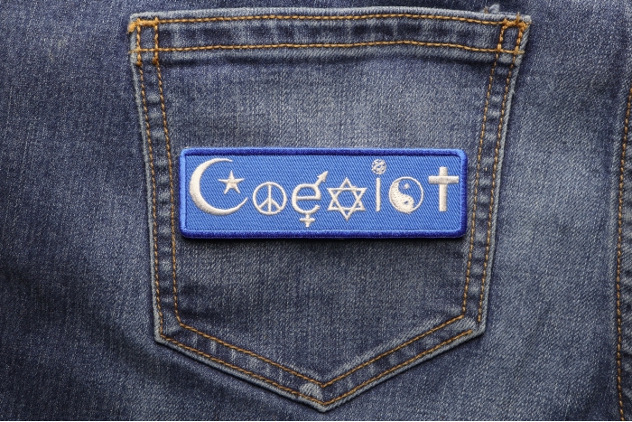 Coexist Iron on Morale Patch shown on jeans