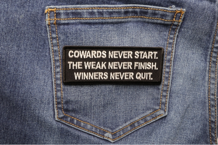 Cowards Never Start. TheWeak Never Finish. Winners Never Quit. Iron on Morale Patch shown on jeans