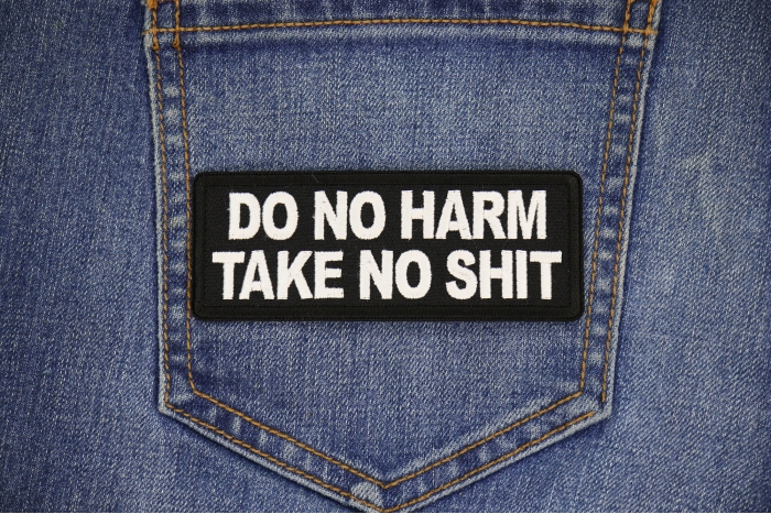 Do no Harm Take no Shit Patch shown on jeans