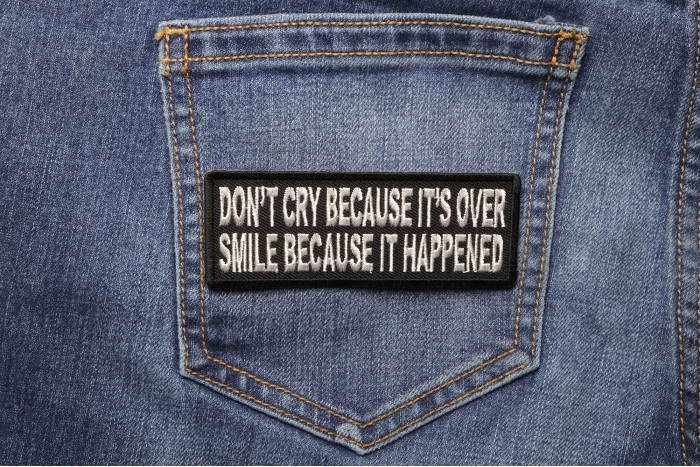 Don't Cry Because It's Over Smile Because It Happened Iron on Morale Patch shown on jeans
