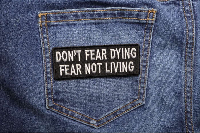 Don't Fear Dying, Fear Not Living Patch shown on jeans